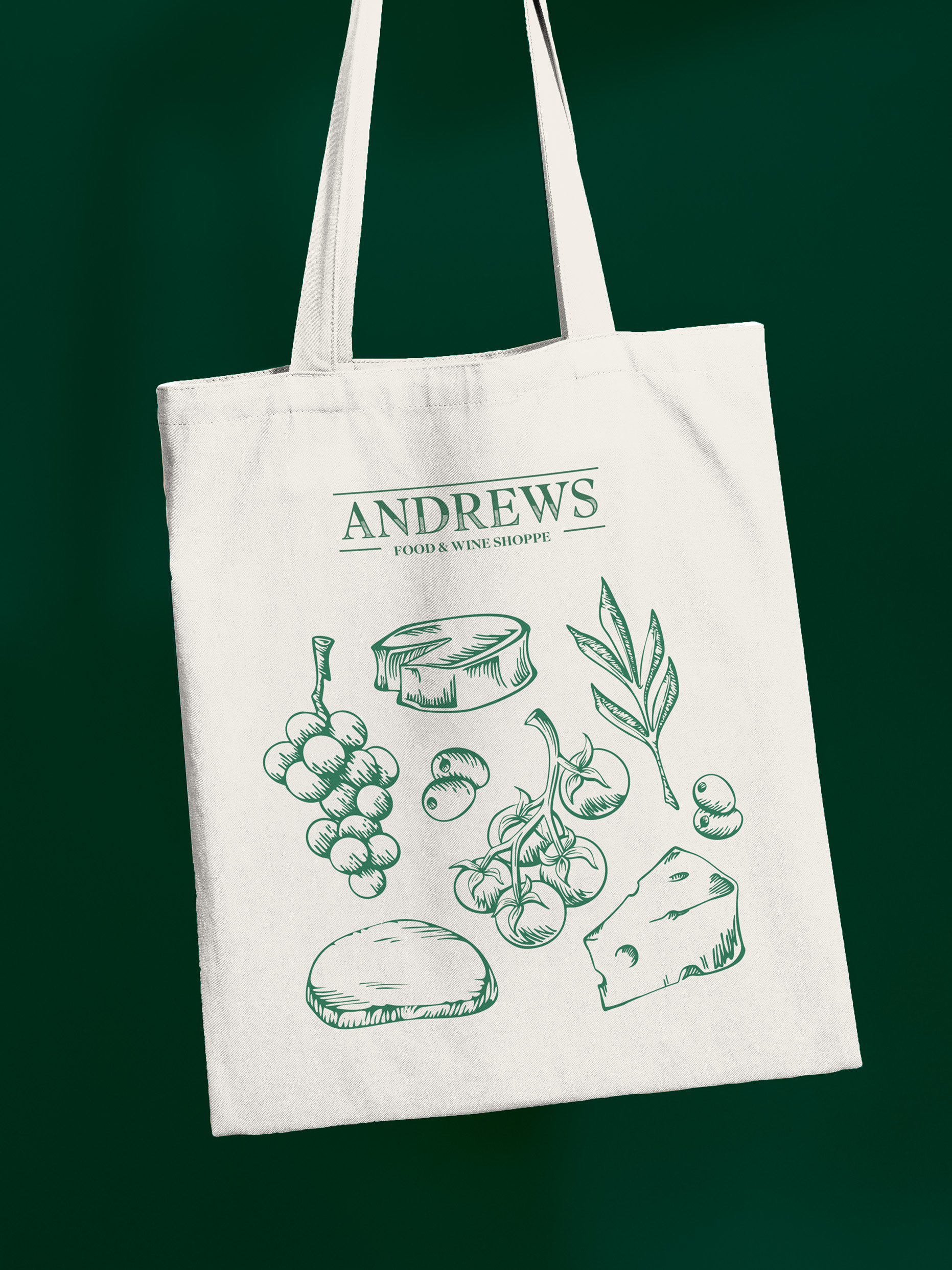 Tote bag wit Andrews wordmark and illustrations of cheese, grapes, bread, and olives